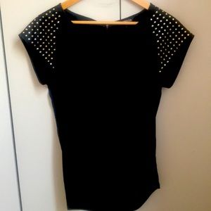 Black blouse with gold sleeve accessories